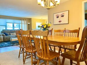 a dining room with a wooden table and chairs at Comfortable Room BU, UHS, Lourdes, Queen Bed in Endicott