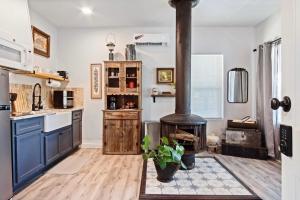 a kitchen with a wood stove in the middle at 1BR Apt 8 mins St Anthony, Unit B in Oklahoma City