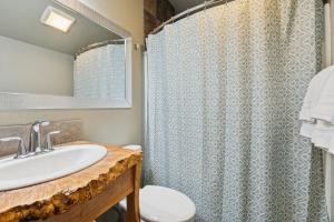 a bathroom with a sink and a shower at Moose Tracks in Whitefish
