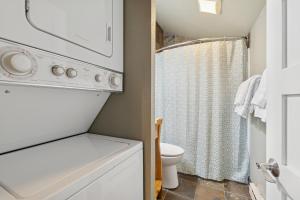 a small bathroom with a toilet and a shower at Moose Tracks in Whitefish