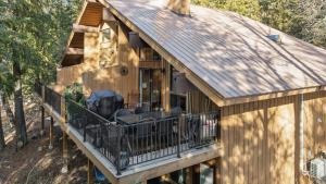 a log cabin with a porch and a balcony at Moose Tracks in Whitefish +30 photos