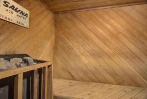 a small sauna with a sign on the wall at Sea Gypsy Rentals in Lincoln City
