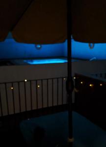 a close up of a table with an umbrella at La Casa del Mar in Barbate