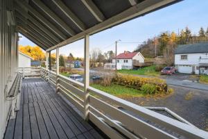 a porch of a house with a view of a street at Alam,s Villa in Kabelvåg
