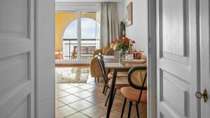 a dining room with a table and chairs at Casa Bellevue in Beausoleil