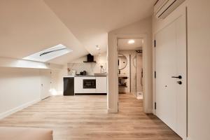 an open hallway with a kitchen and a living room at Agora Palas in Palas de Rei