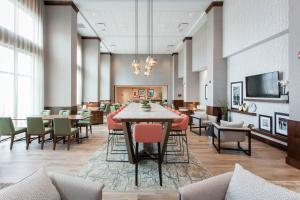 a dining room with a large table and chairs at Hampton Inn & Suites St. George in St. George +19 photos