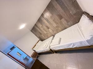 an overhead view of a room with a bed at Pool house, garden, grill in Ica