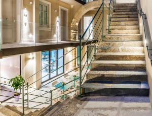 a staircase leading up to a stair case at Hotel San Michele in Trapani