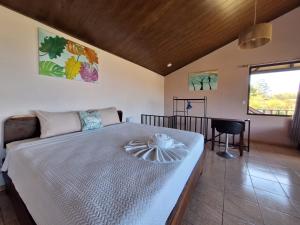 a bedroom with a large bed in a room at Monteverde Cecropia Paradise in Monteverde Costa Rica