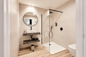 a bathroom with a shower and a sink and a mirror at Agora Palas in Palas de Rei +105 photos