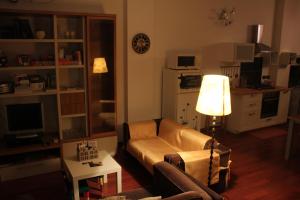 a living room with a couch and a table at La Casa dei Cedri in Fanna
