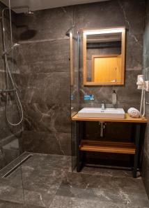 a bathroom with a sink and a shower at Liptov Hills in Liptovský Mikuláš +12 photos