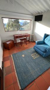 a living room with a couch and a table at Antara House in Guasca