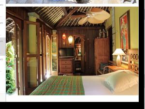 A bed or beds in a room at Villa Paradiso Pousada