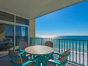 a table and chairs on a balcony with the beach at Jade East Towers 0640 by Newman-Dailey in Destin +54 photos