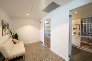 a living room with a couch and a walk in closet at 19th Avenue on the Beach in Gold Coast +49 photos