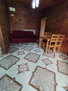 a living room with a couch and stars on the floor at Maranata House in Xuí