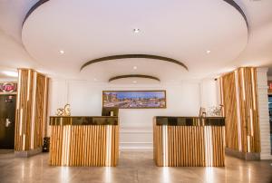 a room with gold and white walls and a ceiling at The Vic, an Ascend Collection Hotel in Victoria +111 photos