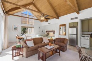 a living room with a couch and a table at Desert Escape with Private Balcony condo in Indian Wells