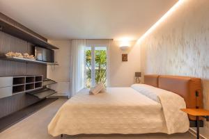a bedroom with a large bed and a window at Elisir Di Pace in Nardò +40 photos