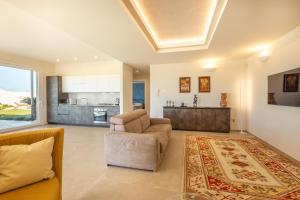 a living room with a couch and a table at Elisir Di Pace in Nardò