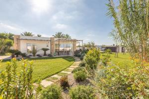 a house with a garden in front of it at Elisir Di Pace in Nardò