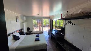 a large room with a bed and a window at Longreach Most Central Motel in Longreach