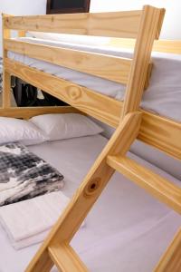 a stack of bunk beds in a room at Edificio AREAS by QuBeLab in Bello +94 photos