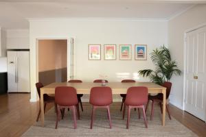 a dining room with a table and chairs at Clara Luce` in Bright