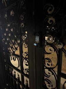a door with a lock on a wrought iron gate at شقق طلال الفندقية- Talal hotel apartments in Al-ʿUla