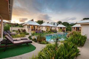 a house with a swimming pool in a yard at The Hidden Lagoon in Rawai Beach