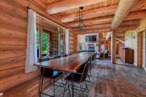 a dining room with a long table and chairs at Fiddler Lake Resort - Moose 46 in Mille-Isles +29 photos