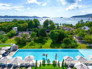 an aerial view of a swimming pool with umbrellas at Chalong Marina Bay View Phuket in Rawai Beach