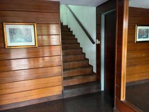 a staircase in a home with wood paneling at NM Apartamentos - LANUS OESTE in Villa Sarmiento +2 photos