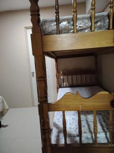 a wooden bunk bed in a room at Beto's house in Santa Ana +9 photos