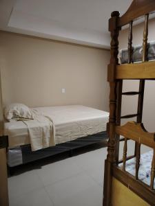 a bedroom with a bunk bed and a ladder at Beto's house in Santa Ana