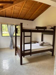 a bedroom with two bunk beds in a room at Finca María Bonita in Horizonte +40 photos