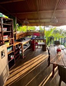 an outdoor patio with a table and a desk at La Roca House in El Valle