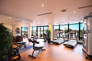 a gym with treadmills and cardio machines at Azerai La Residence, Hue in Hue