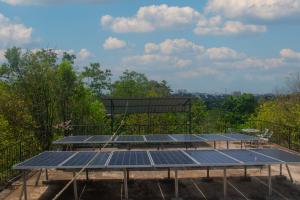 a group of solar panels on top of a building at New Colombo Village in Kalapaluwawa