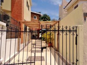 a wrought iron fence in front of a building at Los Caracoles Bed & Breakfast in Cancún