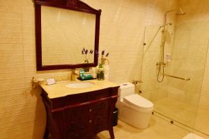 a bathroom with a sink and a shower and a toilet at Boracay Summer Palace Hotel in Boracay +19 photos