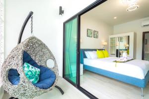 a swing in a bedroom with a bed at Koh Chang Luxury Pool Villas in Ko Chang +36 photos