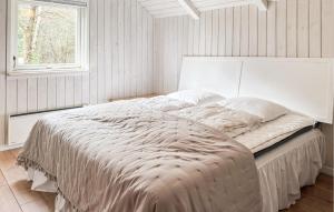 a white bed in a bedroom with a window at Beautiful Home In Ans By in Roe