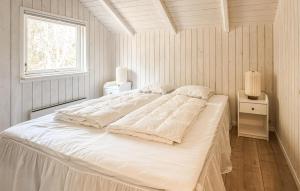 a white bed in a room with a window at Beautiful Home In Ans By in Roe +12 photos