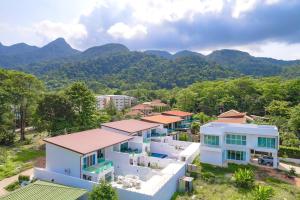 an aerial view of a house with mountains in the background at Koh Chang Luxury Pool Villas in Ko Chang