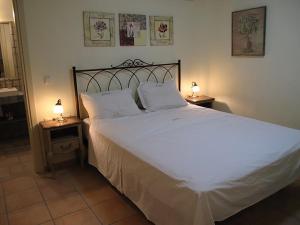 Ένα ή περισσότερα κρεβάτια σε δωμάτιο στο Sohoro
