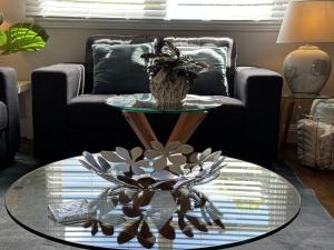 a living room with a glass table and a couch at Daisy Cottage on Duke 2BR in Yarram