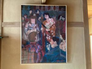 a painting hanging on a wall at 森のしずく in Azumino +23 photos